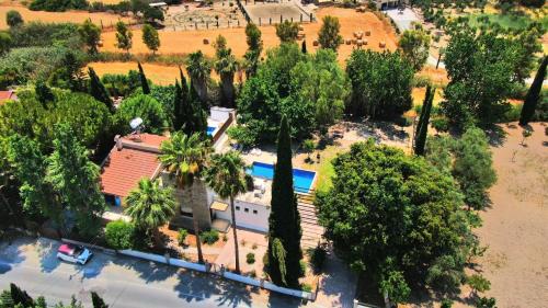 an overhead view of a house with a lot of trees at The Stone Villa in Pissouri