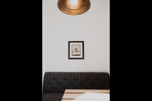 a room with a couch and a picture on the wall at South Main Residences by Surf Hotel in Buena Vista