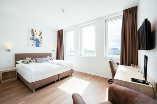 Postel nebo postele na pokoji v ubytování BO Hotel Hamburg