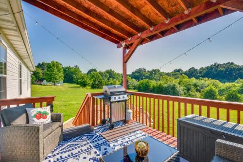 a patio with a grill on a deck at 2 Mi to Dtwn Fulton Meadowlark Home with Deck! in Fulton
