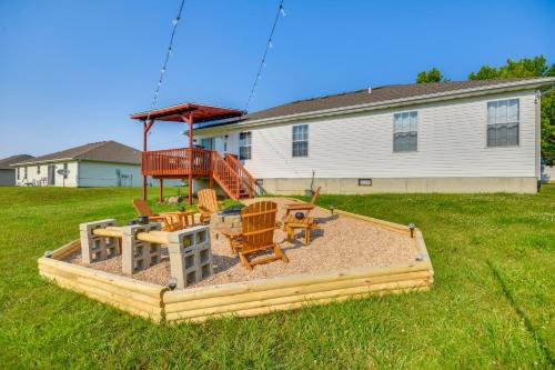 a playground with chairs and tables in a yard at 2 Mi to Dtwn Fulton Meadowlark Home with Deck! in Fulton
