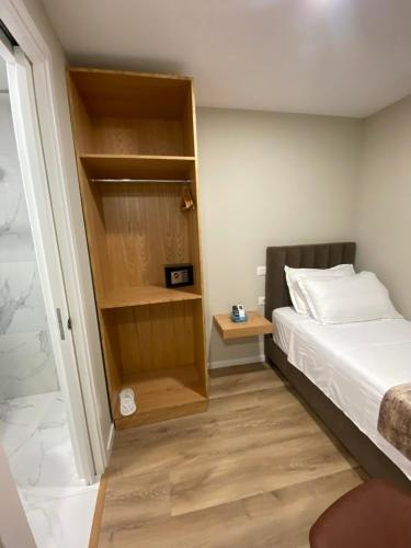 Postel nebo postele na pokoji v ubytování Petite Maison Hermes Center