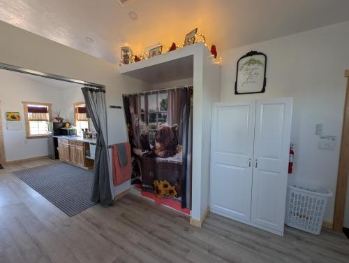 a living room with a hallway and a kitchen at Granny Zola's Hideaway Bed & Breakfast in Saint Anthony