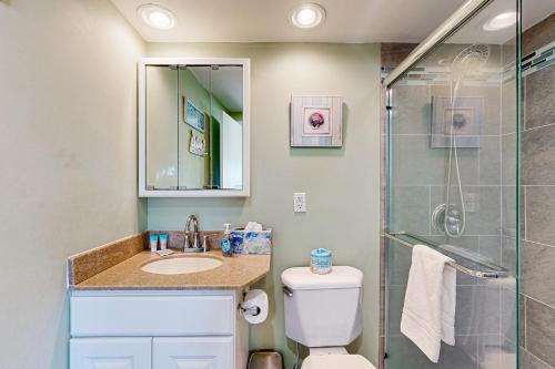 a bathroom with a shower and a toilet and a sink at Sea Colony - 304 Brandywine House in Bethany Beach