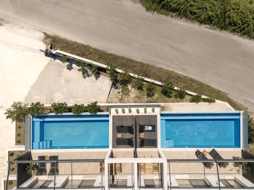 an aerial view of a house with a swimming pool at Anapnoe ikies Corfu Adults Friendly in Sfakerá
