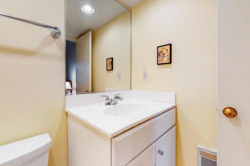a bathroom with a white sink and a mirror at Sea Colony - 203 Brandywine House Rd in Bethany Beach