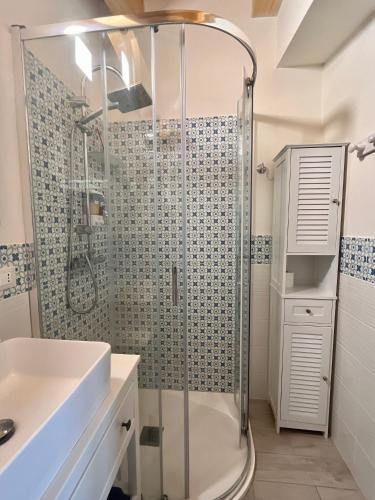 a bathroom with a shower and a sink at The Blue Window - Rooms - 300m from sea in Augusta