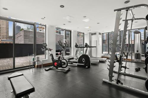 a gym with several treadmills and exercise bikes at GLOBALSTAY Downtown Calgary Apartments in Calgary