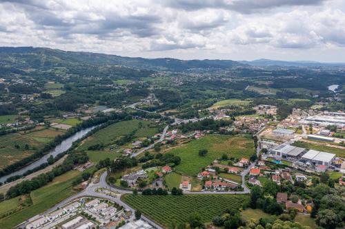 an aerial view of a town with a river and a city at Casa d'Amares in Amares