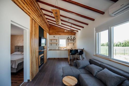 a living room with a couch and a table at Sunny Apartments in Malo Laole
