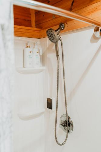 a shower in a bathroom with a shower head at Rustic Escape UTV, Tub, Trails & Fire Pit 25 acre in Roscoe