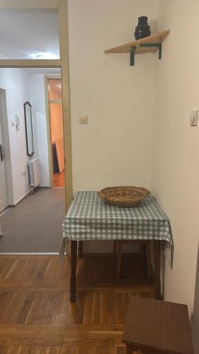a table with a bowl on top of it in a room at Peace in the heart of downtown in Pančevo