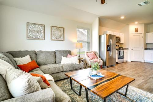 a living room with a couch and a table at 12 Mi to Avery Island Spacious Family Home! in New Iberia