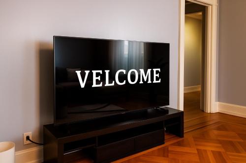 a television with the word welcome written on it at Spacious 4BR near NYC with Parking, 10min MetLife, 20min Times Sq in North Bergen