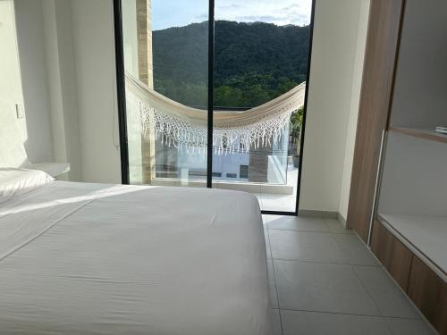 Cama o camas de una habitación en Miramonte Payande