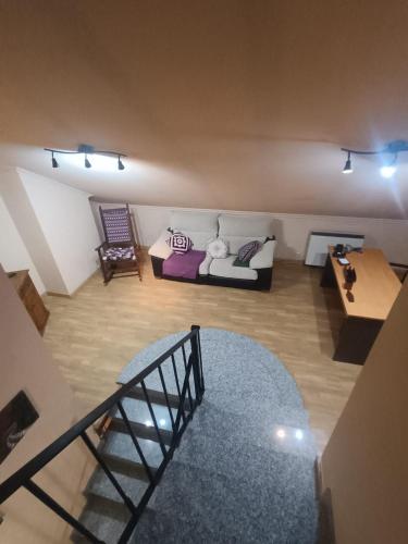 a living room with a couch and a table at Casa Allariz in Allariz