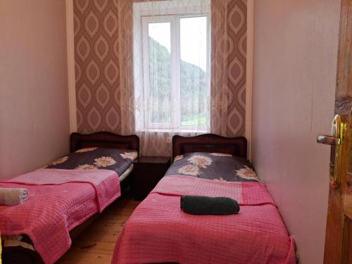 Postel nebo postele na pokoji v ubytování Guest House Koshki