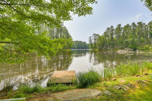 a view of a lake with a wooden dock at Waterfront Studio with Loft and Dock Near Narrowsburg! in Narrowsburg