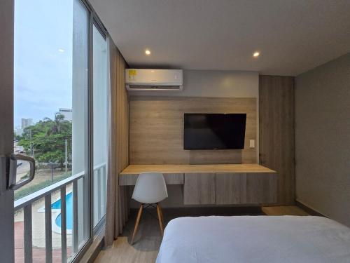 En eller flere senge i et værelse på Apartamento con balcón y vista al lago