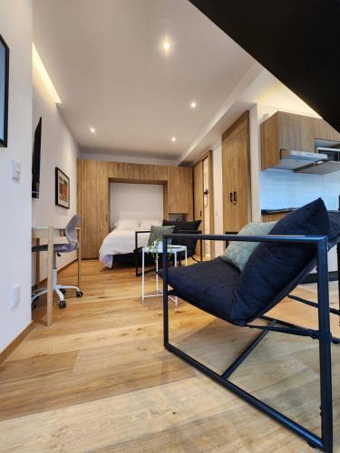a bedroom with a bed and a bed and a desk at Steps to Historic C and Reforma in Mexico City