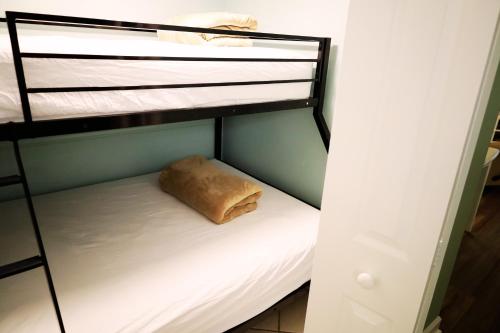 a bunk bed with a pillow on the bottom bunk at Mariner East in Panama City Beach