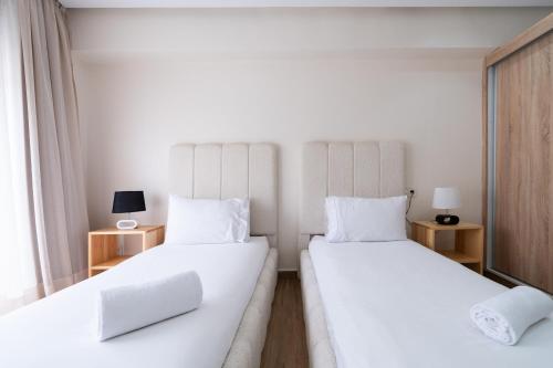 Un ou plusieurs lits dans un hébergement de l'établissement TheCasaEdition - Bel Azur - Sea View & Hassan II Mosqué Residency