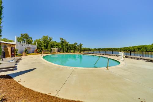 a swimming pool on a concrete driveway at Walk to Lake Home with Community Perks in Canadian! in Canadian