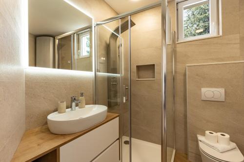 a bathroom with a sink and a shower at Apartment Paula in Novalja