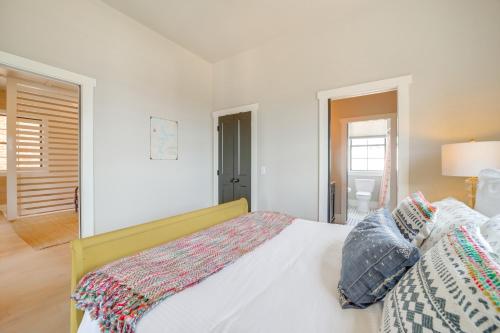 a white bedroom with a bed with pillows on it at Walk to Lake Home with Community Perks in Canadian! in Canadian