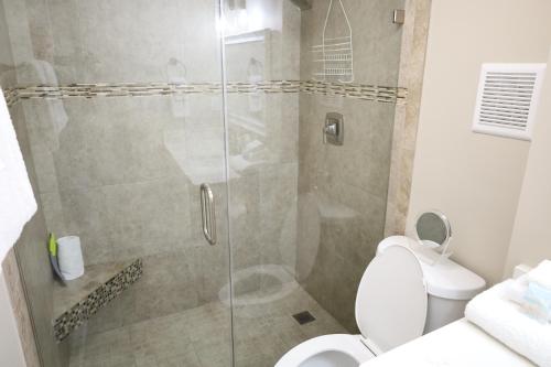 a bathroom with a shower with a toilet at Mariner East in Panama City Beach