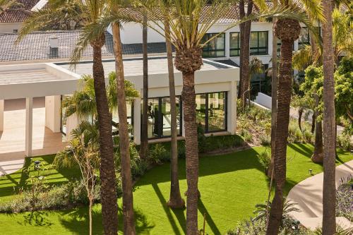 an aerial view of a house with palm trees at Kimpton Los Monteros Marbella by IHG in Marbella