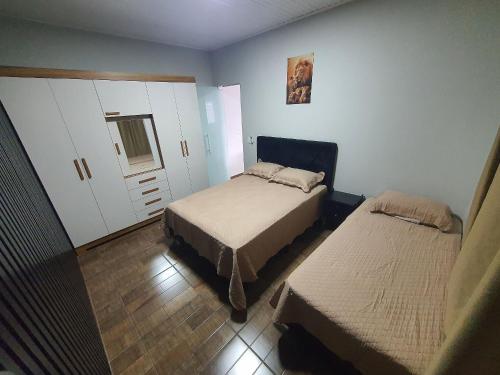 Giường trong phòng chung tại Casa da Ana Cristina