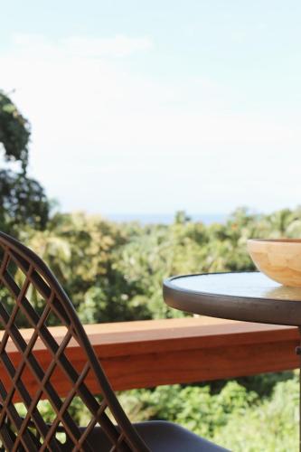 a table with a bowl on top of a table at Muri Ocean View Villas in Ngatangiia