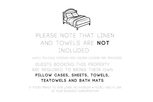 a poster for a bed with a sign that reads please note that linen and towels at The Beach Break in Smiths Beach