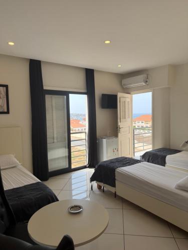 Ένα ή περισσότερα κρεβάτια σε δωμάτιο στο MARIN Hôtel