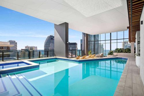 a swimming pool with a view of the city at Modern 1 Bedroom Unit at The Casino - NO PARKING - Q Stay in Gold Coast