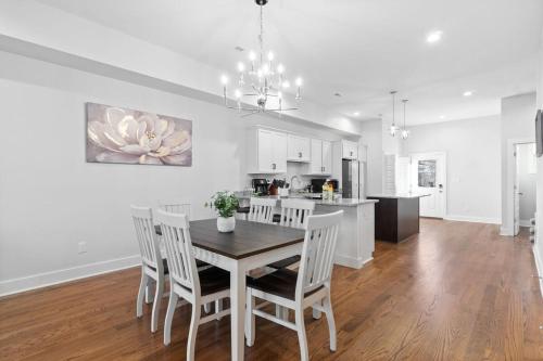 a kitchen and dining room with a table and chairs at Unit #C 527 N 1st St in Clarksville