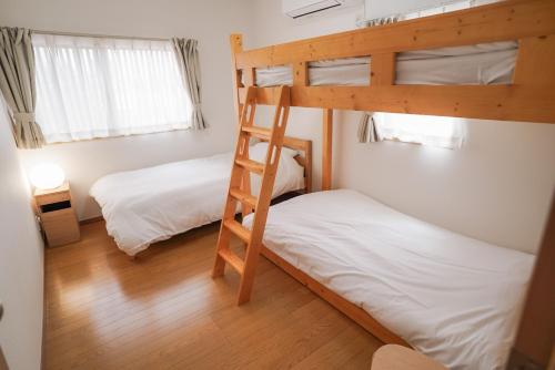 Postel nebo postele na pokoji v ubytování Tipy records inn nook