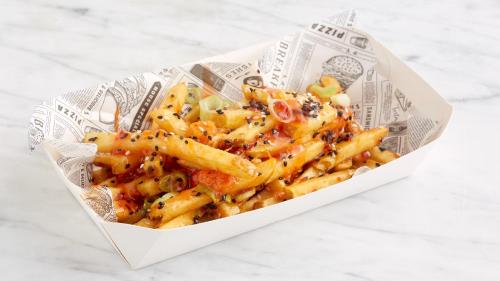 a bowl of pasta with cheese and spices at Holiday Inn Milton Keynes East M1 Junc 14 by IHG in Milton Keynes