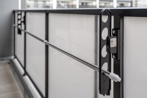 a metal railing with a latch on a door at Apartment Hotel 11 Higashi Umeda in Osaka