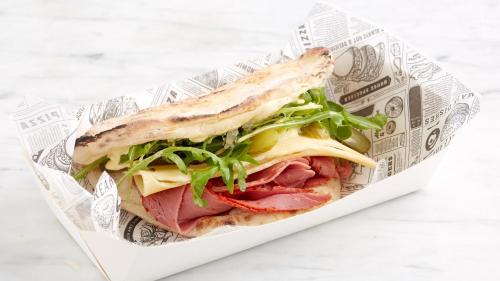a sandwich with meat and lettuce in a paper container at Holiday Inn Leeds-Wakefield M1 Jct40 by IHG in Wakefield