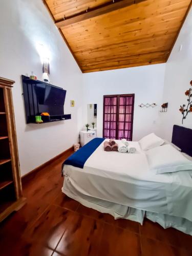 Ένα ή περισσότερα κρεβάτια σε δωμάτιο στο Pousada Villa dos Quilombolas