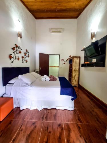 Ένα ή περισσότερα κρεβάτια σε δωμάτιο στο Pousada Villa dos Quilombolas