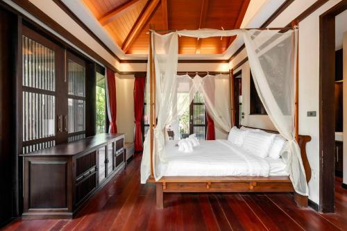 Voodi või voodid majutusasutuse The Retreat Koh Samui toas