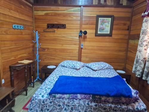 En eller flere senge i et værelse på Lugar de paz e sossego