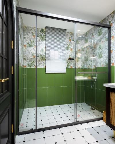 a shower in a bathroom with green tiles at Luxury Riverside House with Garden in Central Suzhou in Suzhou