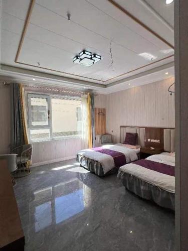 Katil atau katil-katil dalam bilik di Jinshanling Great Wall Longteng Farmhouse