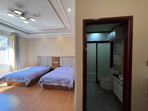 Katil atau katil-katil dalam bilik di Jinshanling Great Wall Longteng Farmhouse