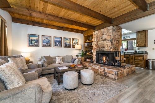 a living room with a couch and a fireplace at Mountain Getaway - Lake Tahoe - Incline Village - Private Garage in Incline Village