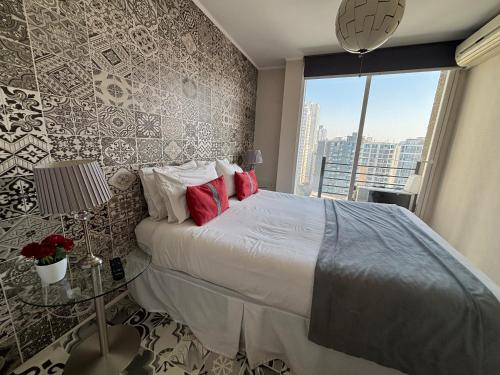 En eller flere senge i et værelse på Hermoso Apartamento en la Capital de Chile